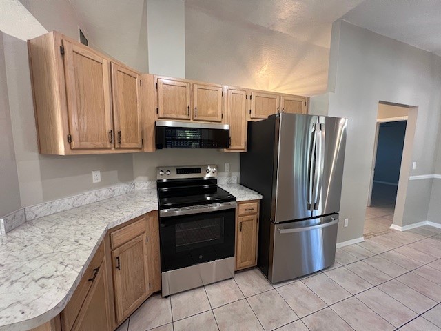 762 Bayfront Terrace Sebastian, FL 32958 - Photo 6 of 11 a kitchen with stainless steel appliances granite countertop a refrigerator stove and microwave