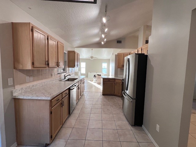 762 Bayfront Terrace Sebastian, FL 32958 - Photo 7 of 11 a kitchen with stainless steel appliances granite countertop a refrigerator a sink a stove a washer dryer and a refrigerator