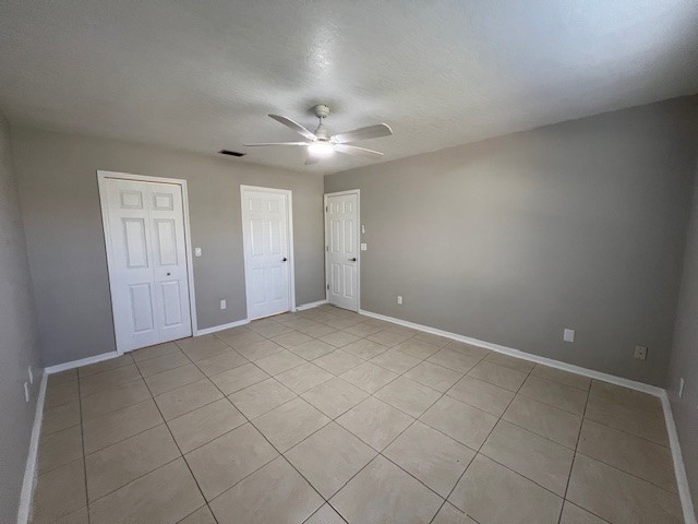 762 Bayfront Terrace Sebastian, FL 32958 - Photo 8 of 11 an empty room with windows and fan
