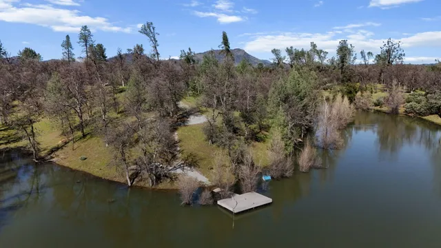 an aerial view of residential house and green space