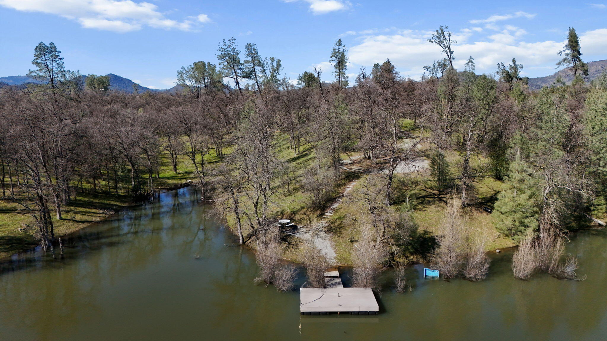 Nsa Bernard Way Redding, CA 96003 - Photo 12 of 20 a view of a lake with houses
