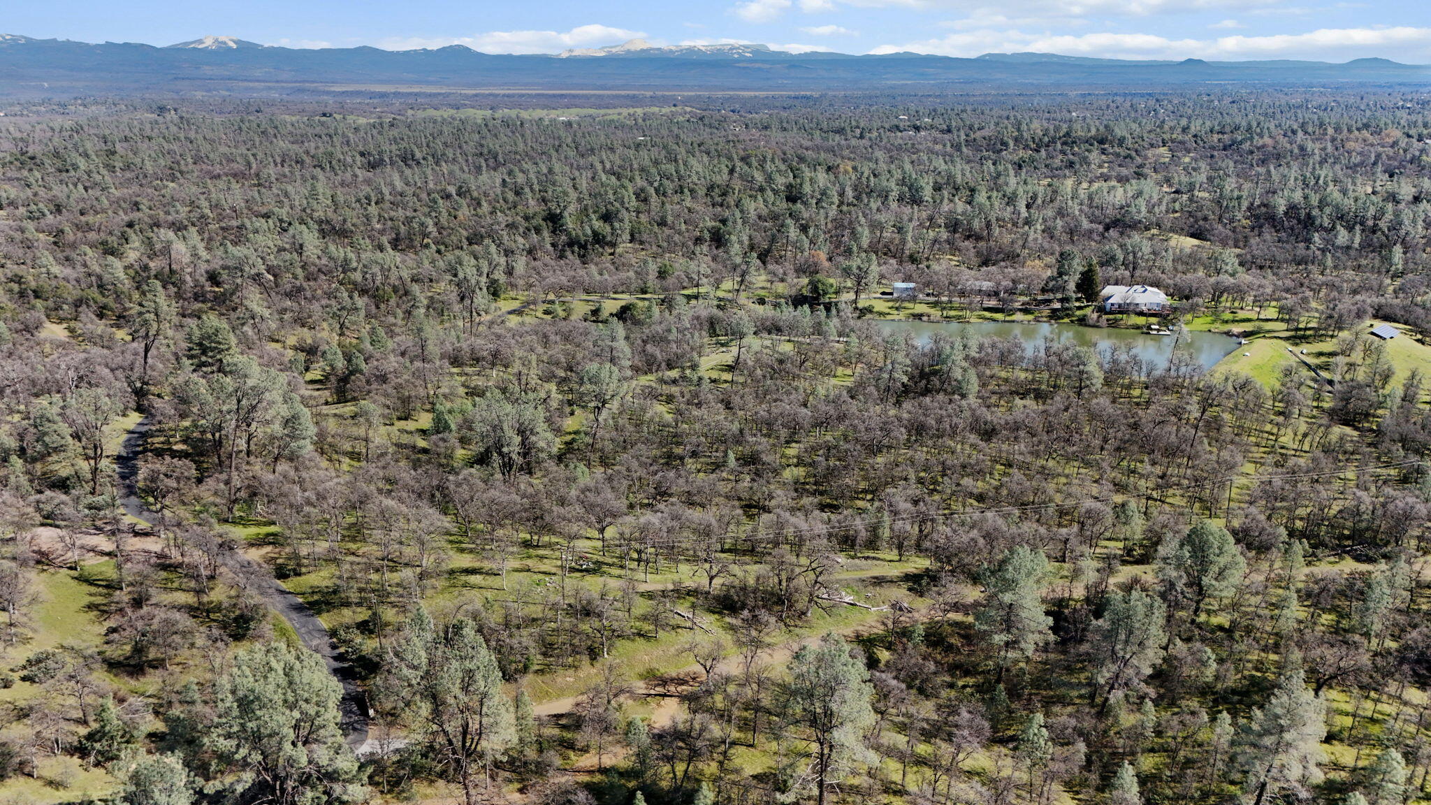 Nsa Bernard Way Redding, CA 96003 - Photo 3 of 20 a view of a lake with mountains in the background