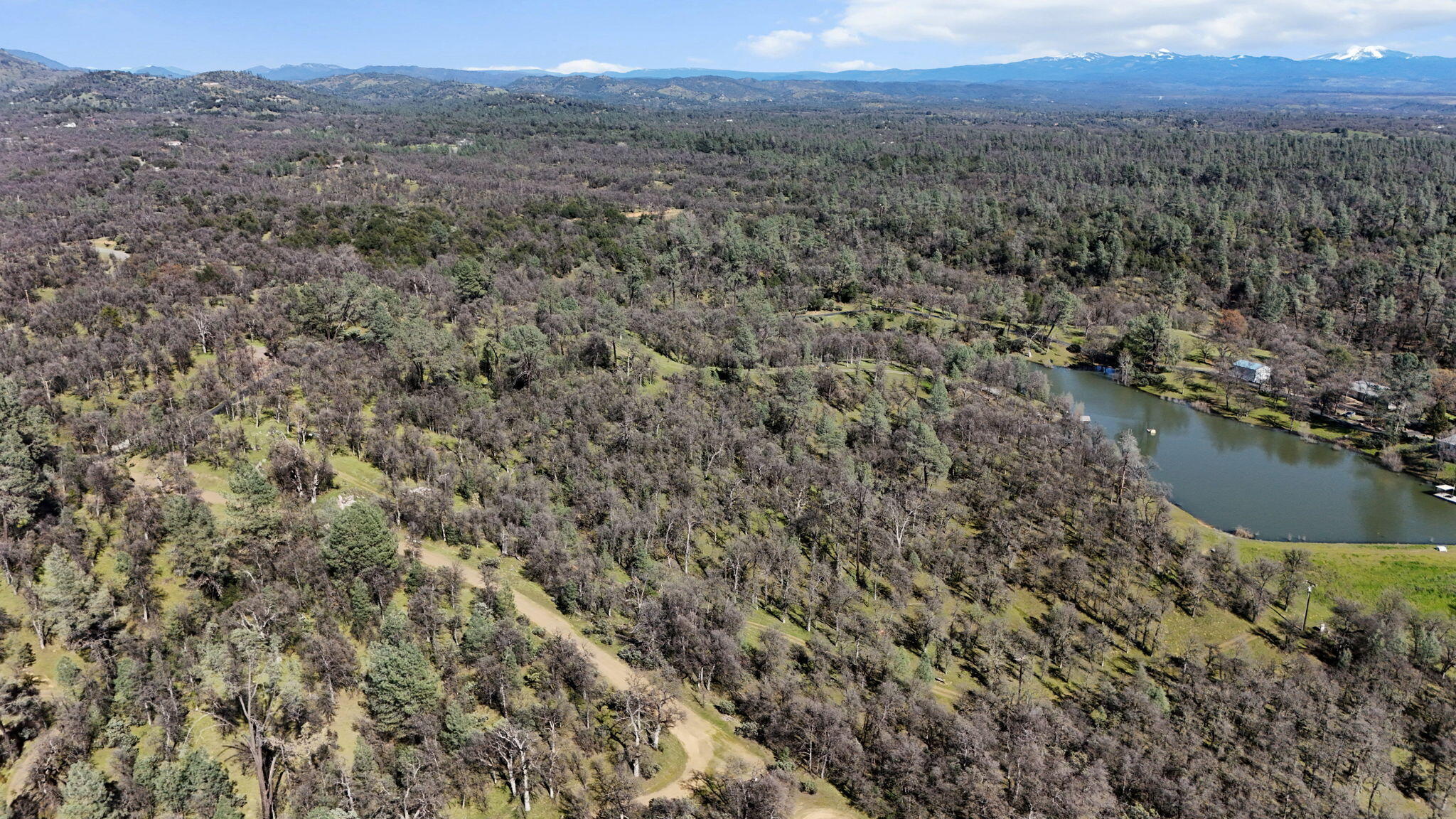 Nsa Bernard Way Redding, CA 96003 - Photo 4 of 20 a view of a lake with a mountain in the background