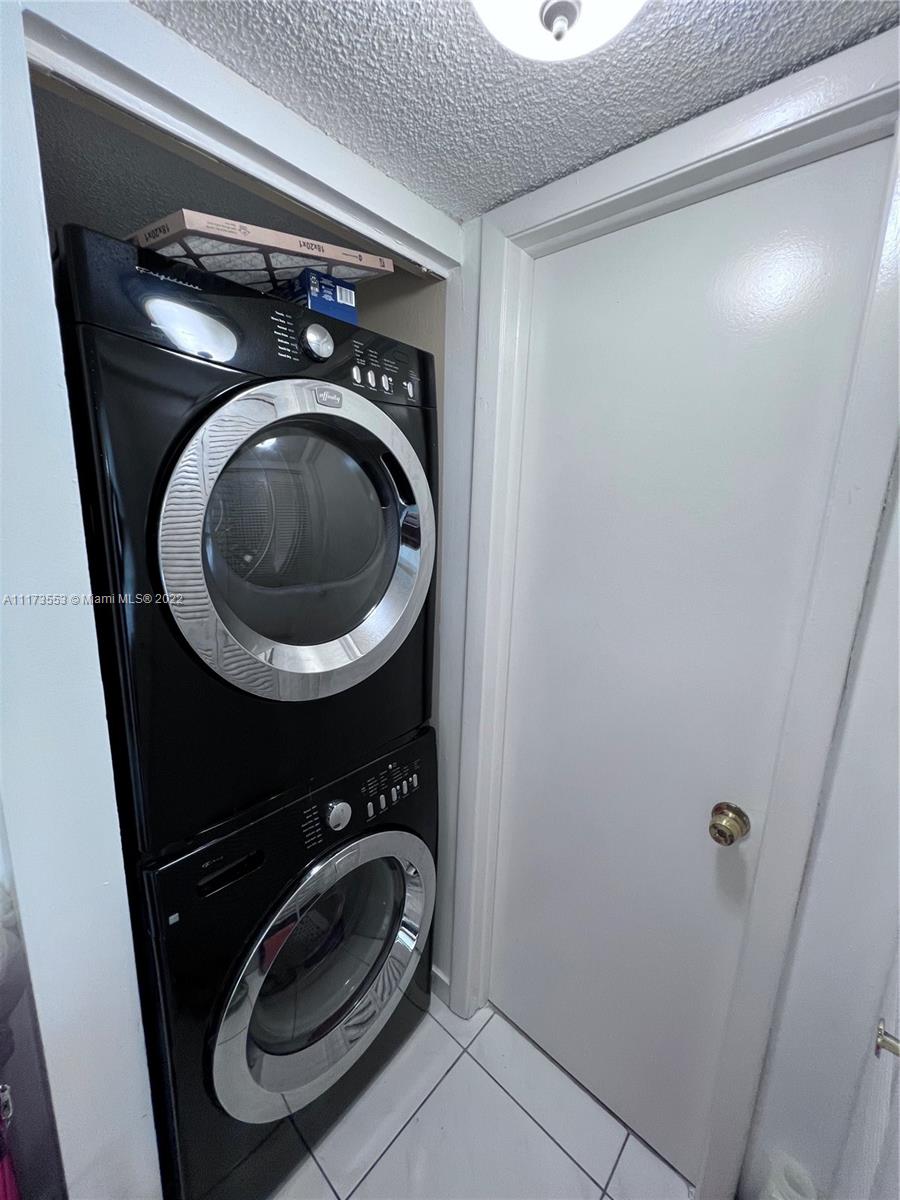 2075 Southwest 122nd Avenue, Unit 320 Miami, FL 33175 - Photo 15 of 38 a utility room with dryer and washer