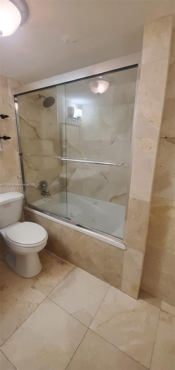 2075 Southwest 122nd Avenue, Unit 320 Miami, FL 33175 - Photo 25 of 38 a bathroom with a shower and a toilet