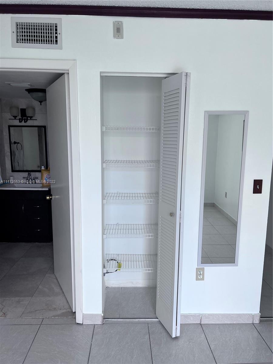 2075 Southwest 122nd Avenue, Unit 320 Miami, FL 33175 - Photo 29 of 38 a bathroom with a bathtub and a sink