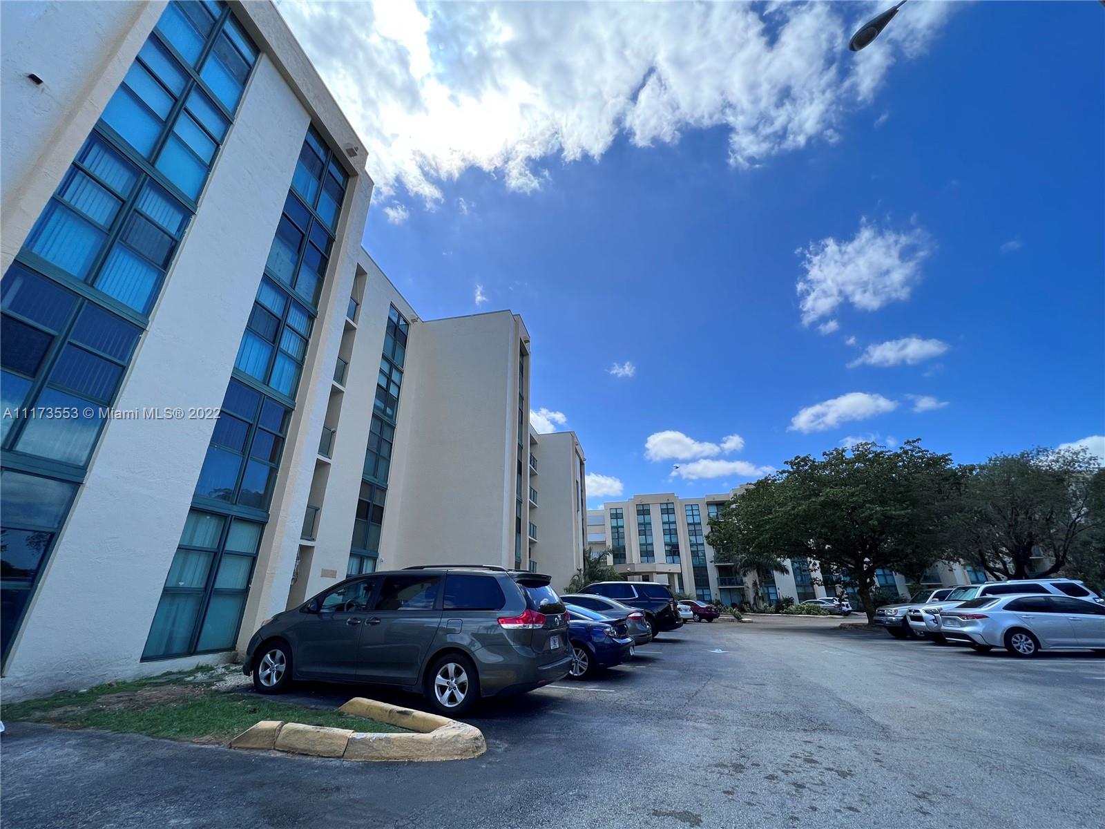 2075 Southwest 122nd Avenue, Unit 320 Miami, FL 33175 - Photo 34 of 38 a cars parked on the side of a street
