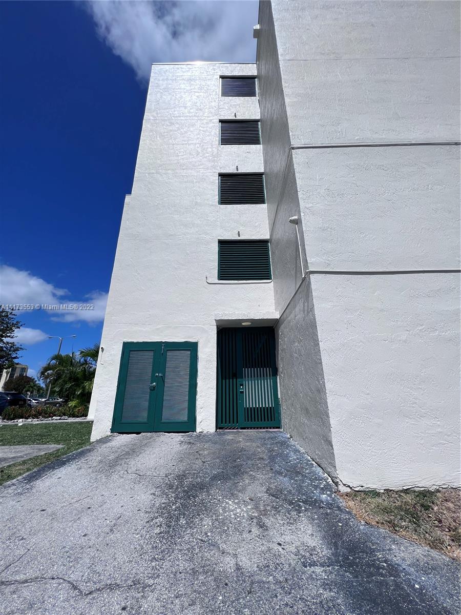 2075 Southwest 122nd Avenue, Unit 320 Miami, FL 33175 - Photo 36 of 38 front view of a house with a yard
