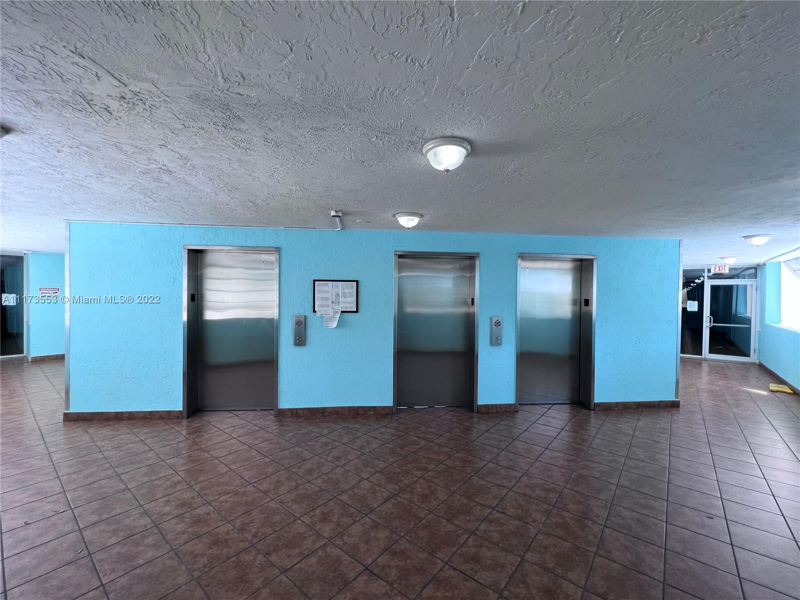 2075 Southwest 122nd Avenue, Unit 320 Miami, FL 33175 - Photo 6 of 38 a view of a hall with wooden floor