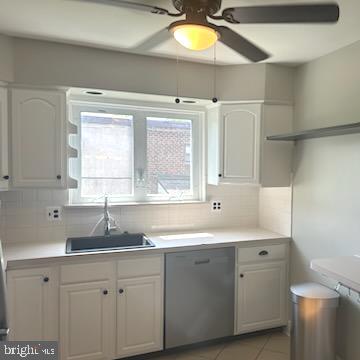 328 Hoffnagle Street, Unit 2 Philadelphia, PA 19111 - Photo 11 of 39 a kitchen with a sink cabinets and window