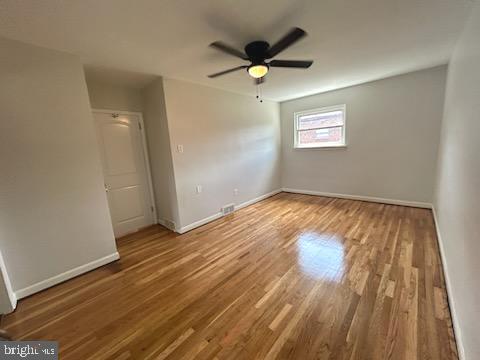 328 Hoffnagle Street, Unit 2 Philadelphia, PA 19111 - Photo 19 of 39 wooden floor in an empty room with a window