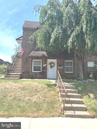 328 Hoffnagle Street, Unit 2 Philadelphia, PA 19111 - Photo 2 of 39 a front view of a house with a yard