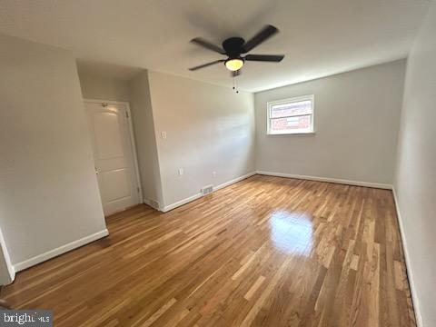328 Hoffnagle Street, Unit 2 Philadelphia, PA 19111 - Photo 22 of 39 wooden floor in an empty room with a window
