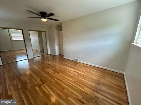 328 Hoffnagle Street, Unit 2 Philadelphia, PA 19111 - Photo 24 of 39 a view of an empty room with wooden floor and a window