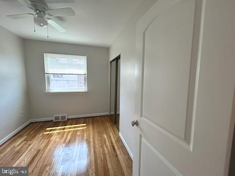 328 Hoffnagle Street, Unit 2 Philadelphia, PA 19111 - Photo 29 of 39 wooden floor in an empty room with a window