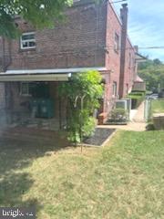 328 Hoffnagle Street, Unit 2 Philadelphia, PA 19111 - Photo 33 of 39 a view of backyard with a fountain plants and large tree