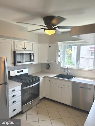 328 Hoffnagle Street, Unit 2 Philadelphia, PA 19111 - Photo 10 of 39 a kitchen with granite countertop a sink stainless steel appliances and cabinets