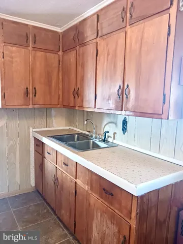 a kitchen with a sink and cabinets