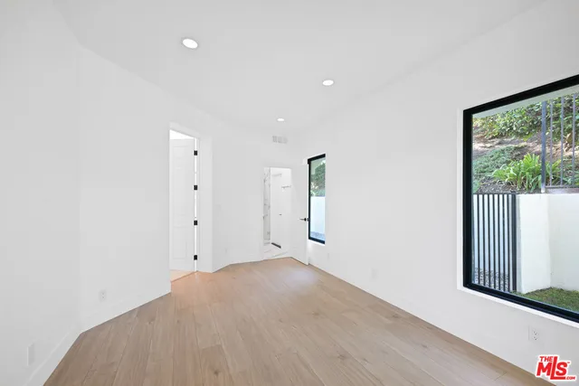 a kitchen with stainless steel appliances granite countertop a sink and a stove