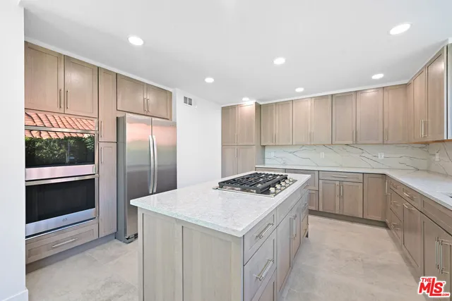 a view of a kitchen with cabinets