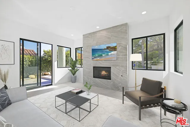 a bathroom with a double vanity sink mirror and bathtub