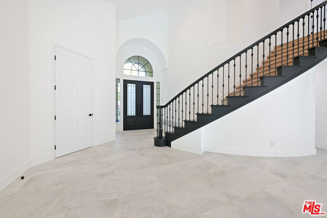 5566 Spring Hill Court Westlake Village, CA 91362 - Photo 26 of 66 a view of a hallway with staircase