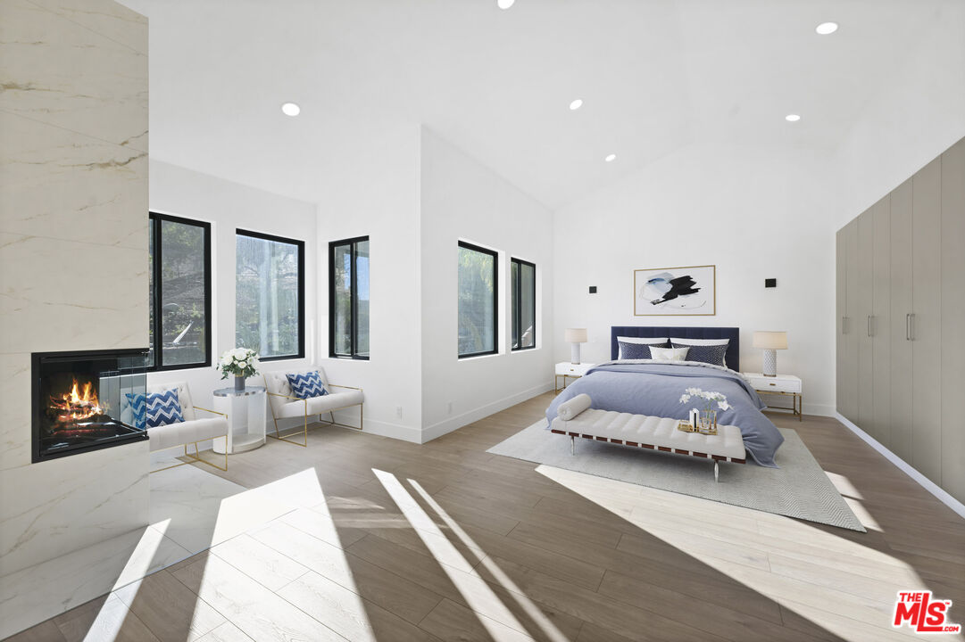 5566 Spring Hill Court Westlake Village, CA 91362 - Photo 28 of 66 a bedroom with a large bed and a window