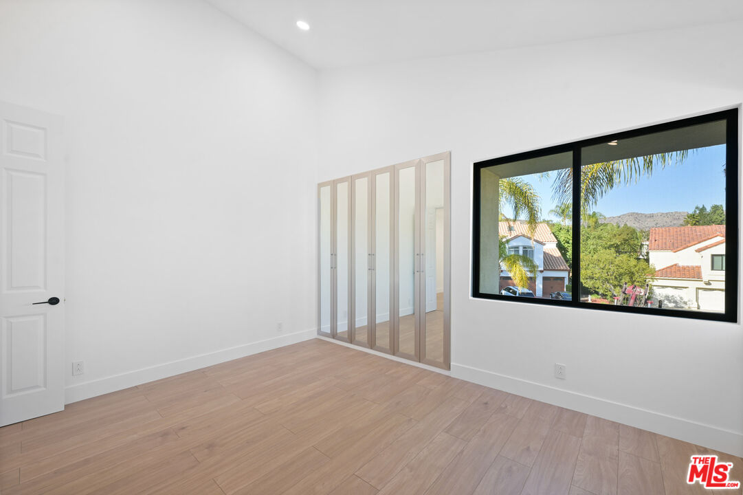 5566 Spring Hill Court Westlake Village, CA 91362 - Photo 38 of 66 an empty room with a large window