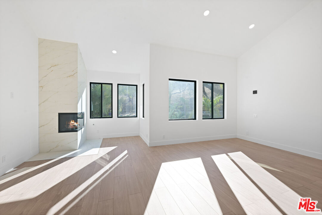 5566 Spring Hill Court Westlake Village, CA 91362 - Photo 43 of 66 a view of an empty room with wooden floor and a window