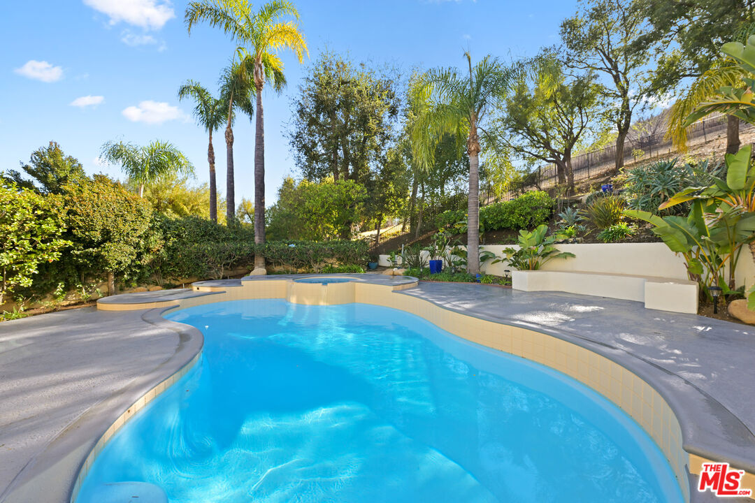 5566 Spring Hill Court Westlake Village, CA 91362 - Photo 52 of 66 a view of yard with swimming pool and outdoor seating