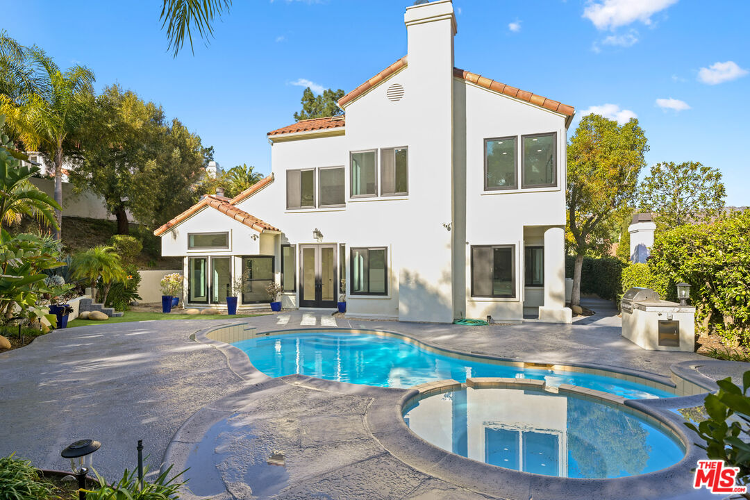 5566 Spring Hill Court Westlake Village, CA 91362 - Photo 53 of 66 a view of a house with backyard and sitting area