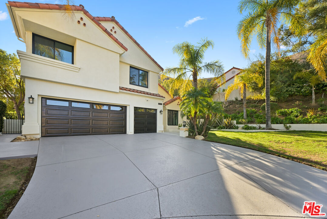 5566 Spring Hill Court Westlake Village, CA 91362 - Photo 64 of 66 a view of house with swimming pool and a yard