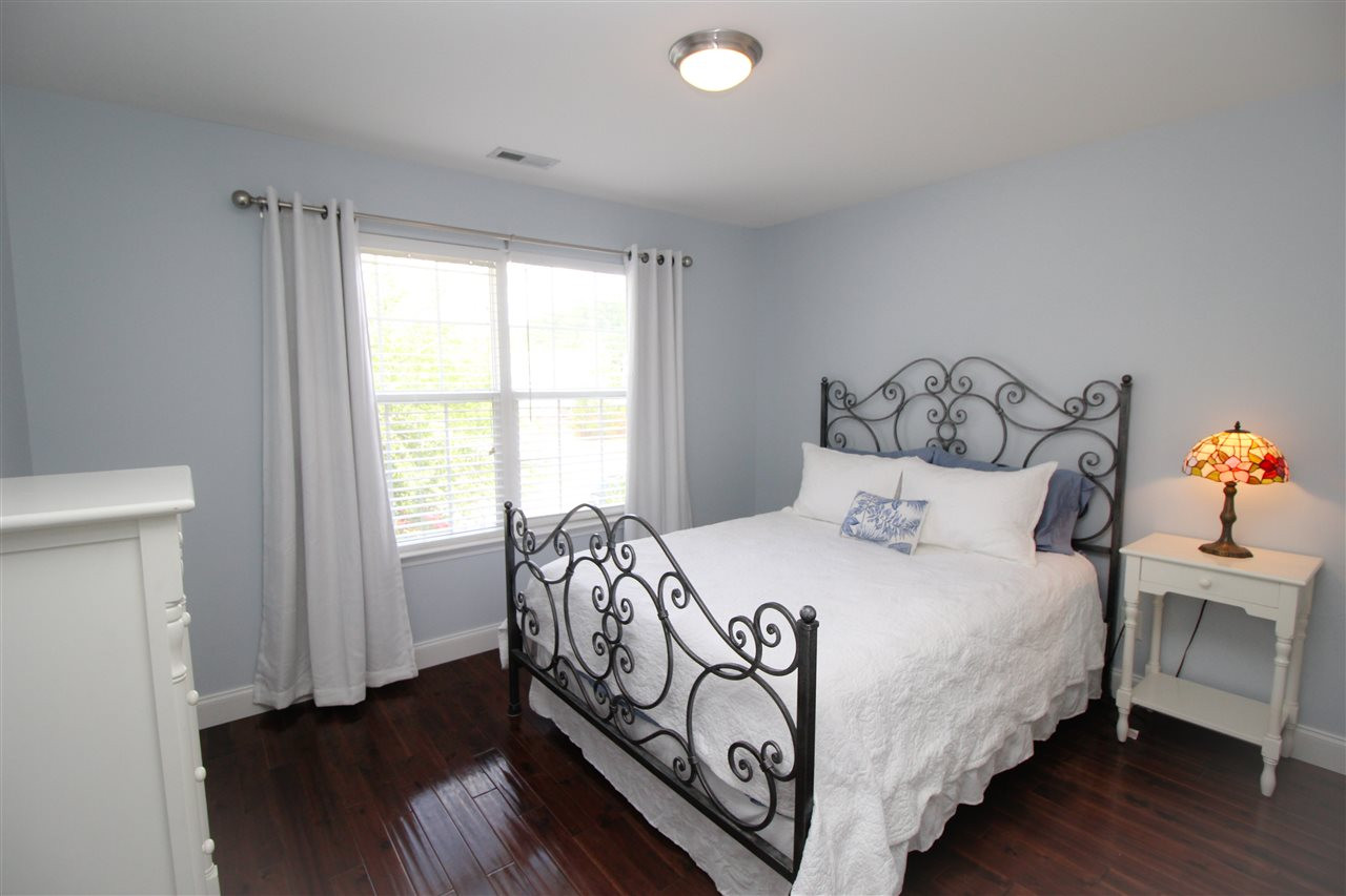 201 Riley Oaks Lane Apex, NC 27539 - Photo 20 of 29 Spacious secondary bedrooms with stunning hardwood floors! Bedroom
