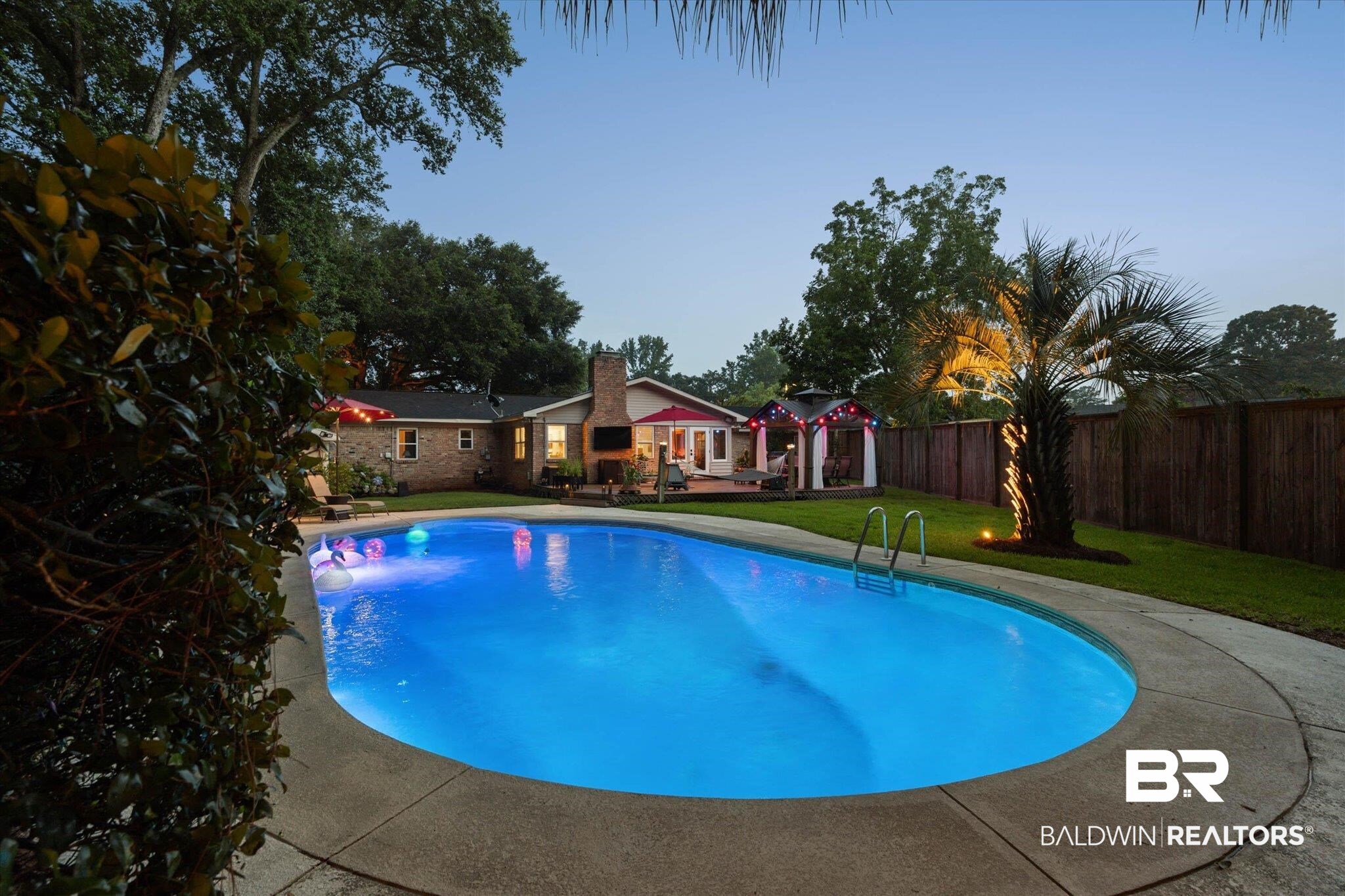 101 Ann Street Daphne, AL 36527 - Photo 33 of 38 Oval-shaped in-ground swimming pool with concrete surround