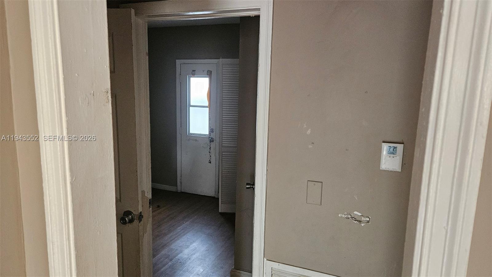 742 Southwest 10th Street Miami, FL 33130 - Photo 5 of 9 a view of a hallway with wooden floor