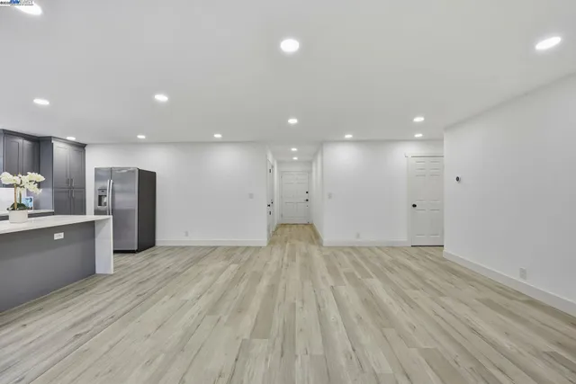 a view of a kitchen with a sink and an oven