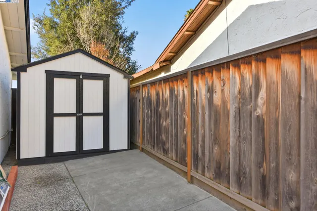 a view of outdoor space with wooden fence