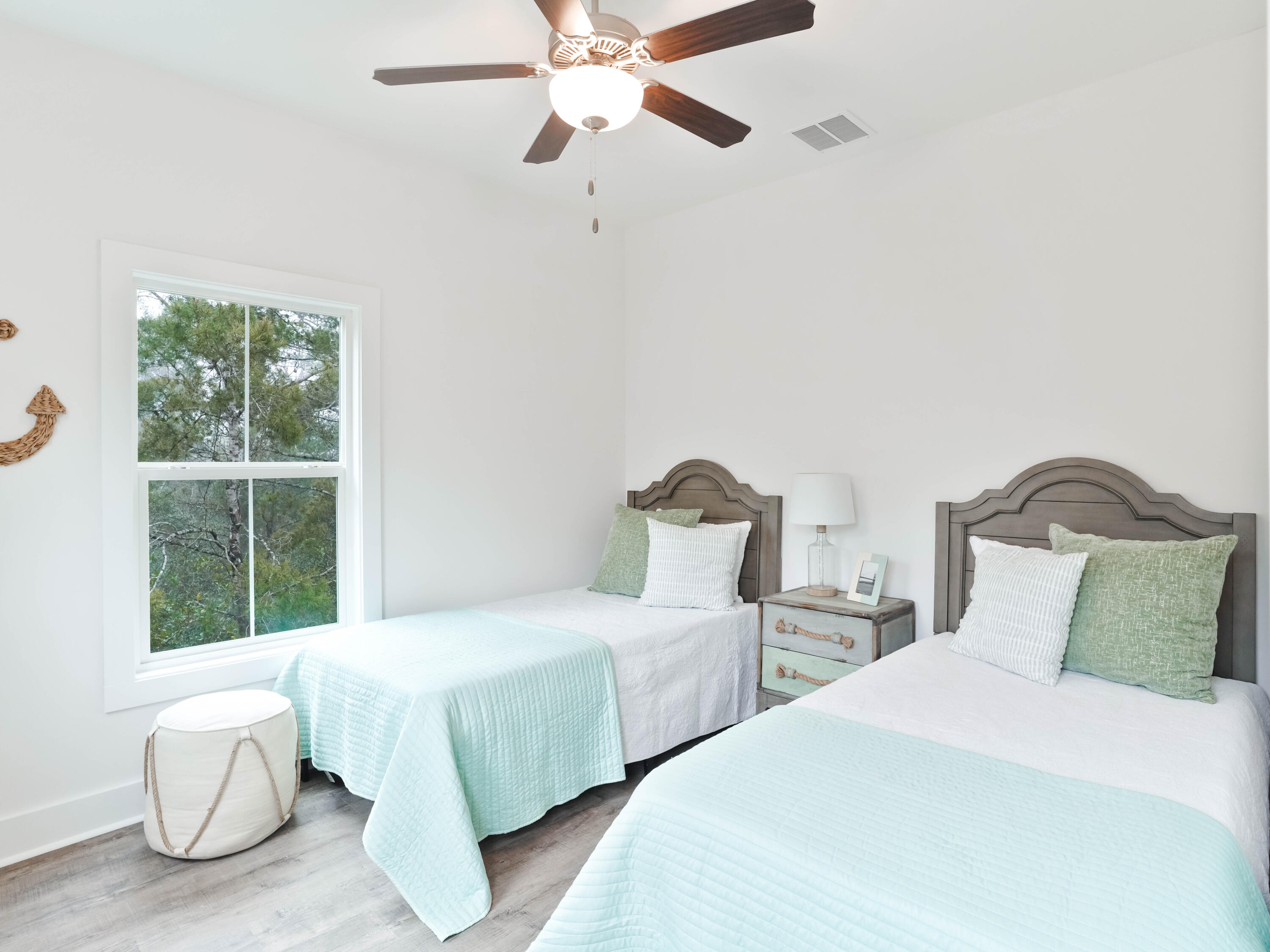 112 North Wall St Inlet Beach Inlet Beach, FL 32461 - Photo 16 of 26 a bedroom with two beds and large window