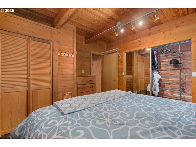 a bedroom with a bed and a walk in closet