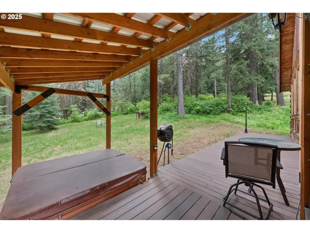 a sitting area with furniture and wooden floor