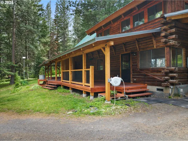a view of a house with backyard tub and sitting area