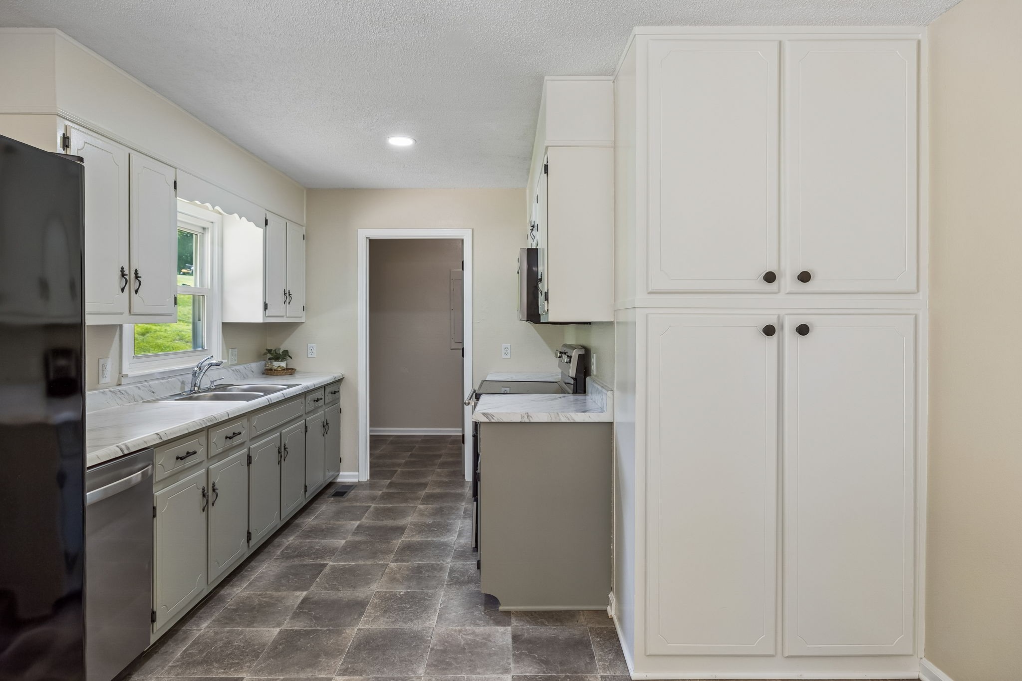 14 Morris Lane Carthage, TN 37030 - Photo 19 of 31 a kitchen with stainless steel appliances granite countertop a refrigerator a sink and white cabinets