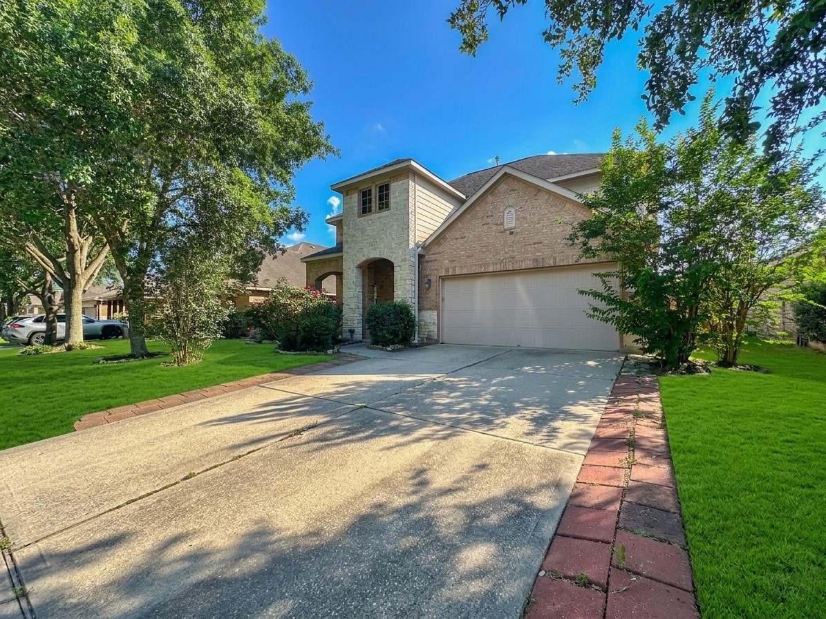 20319 Little Wing Drive Spring, TX 77388 - Photo 4 of 49 a view of a yard with brick house