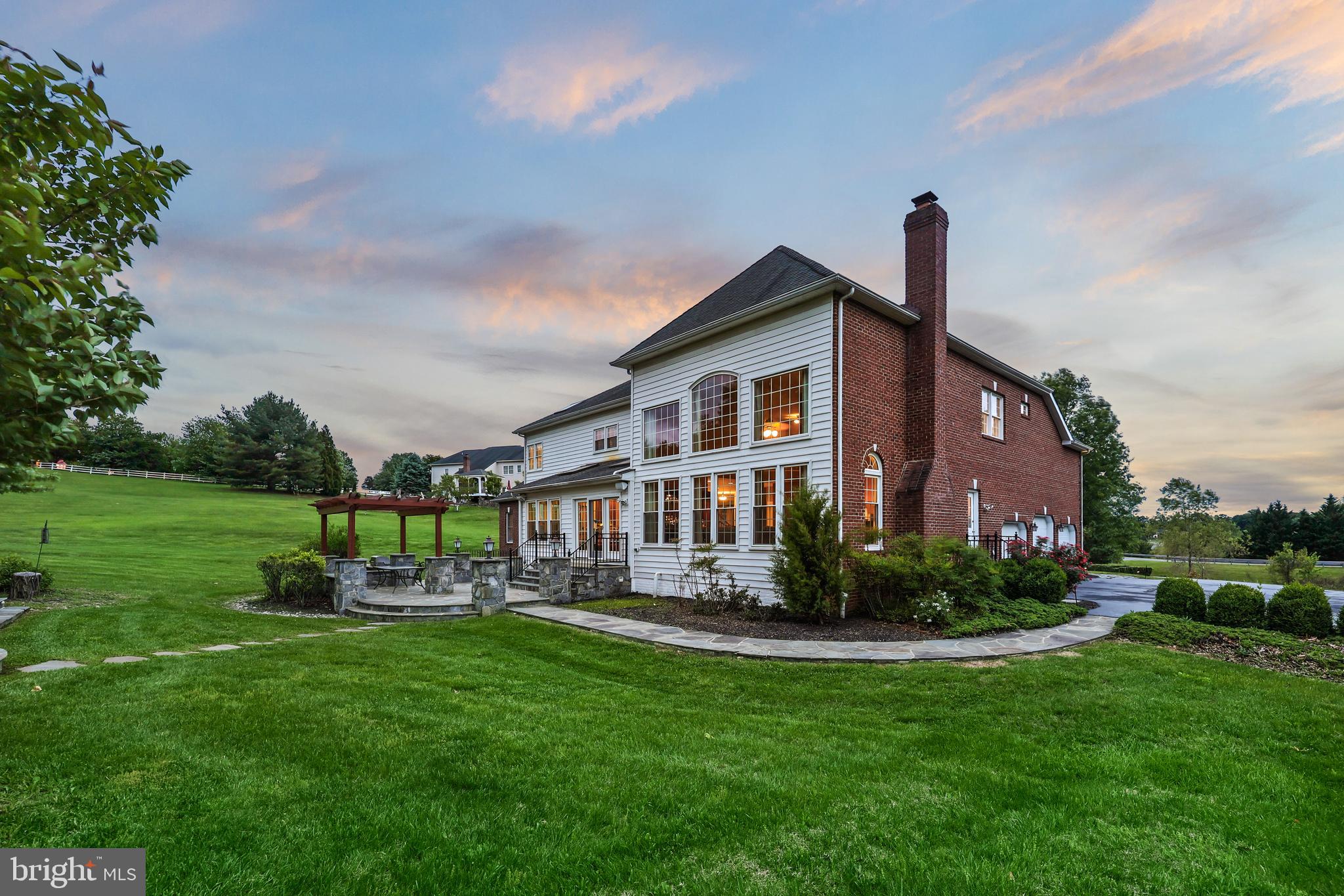 40890 Beechnut Road Leesburg, VA 20175 - Photo 55 of 65 a front view of a house with garden