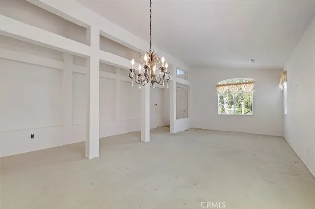 a view of an empty room with glass door