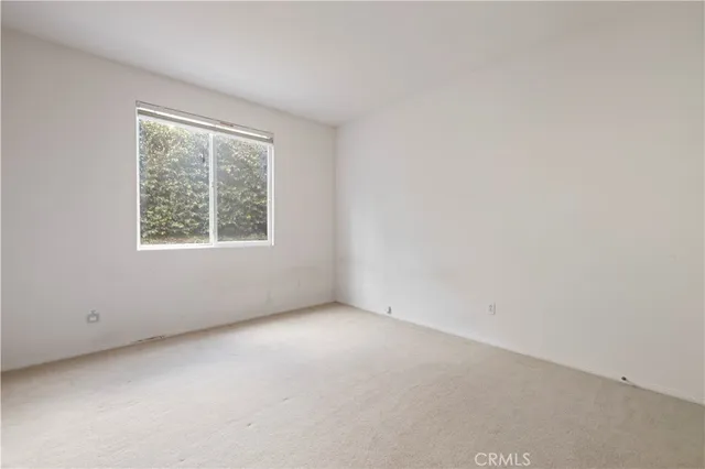 a spacious bathroom with a double vanity sink a mirror and a bathtub