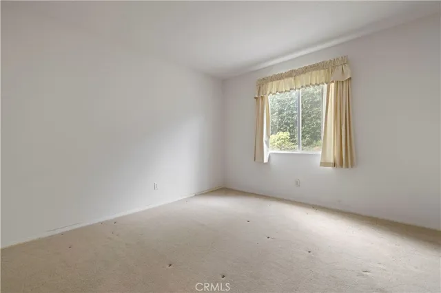a kitchen with a sink a counter top space appliances and cabinets