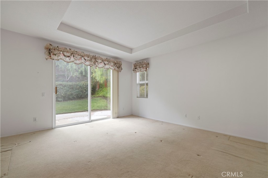 25018 Smokewood Way Stevenson Ranch, CA 91381 - Photo 27 of 71 a view of an empty room with glass door