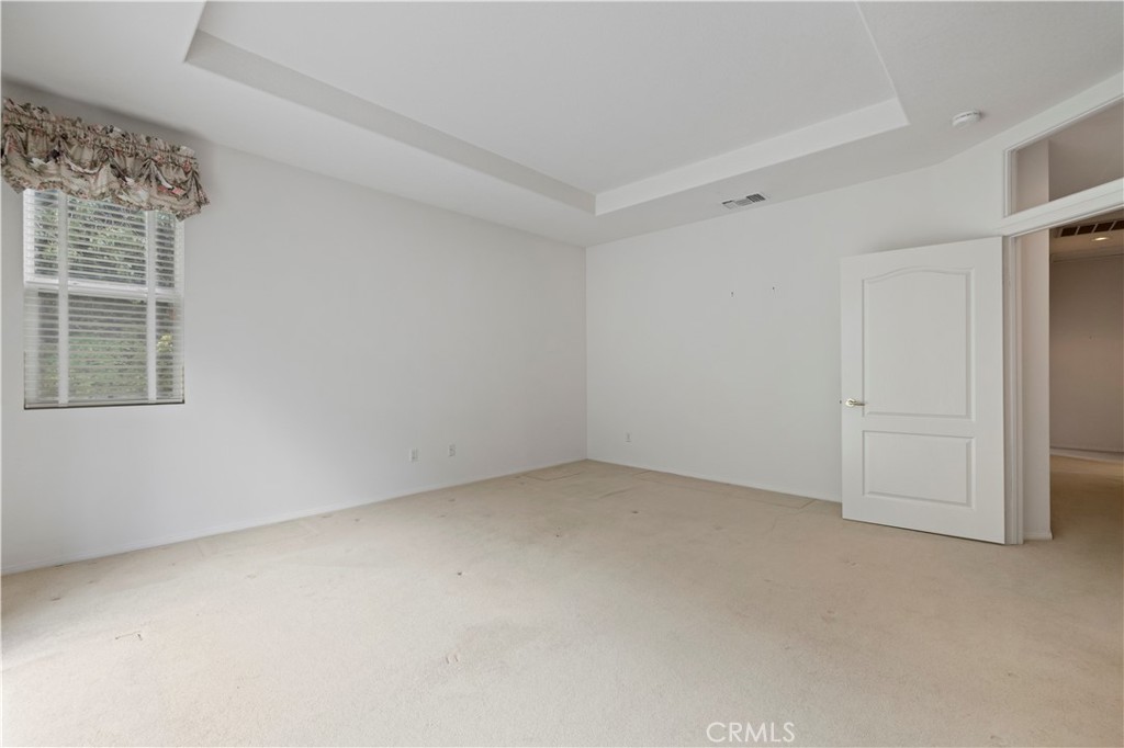 25018 Smokewood Way Stevenson Ranch, CA 91381 - Photo 30 of 71 an empty room with windows