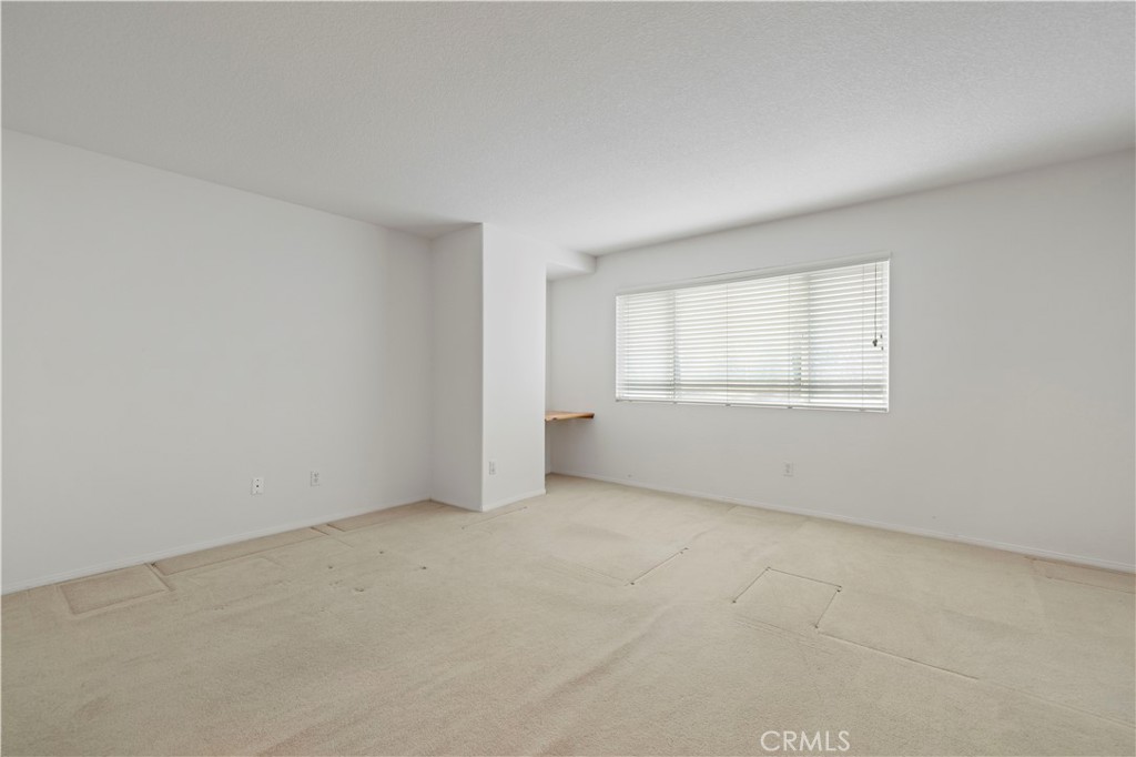 25018 Smokewood Way Stevenson Ranch, CA 91381 - Photo 46 of 71 an empty room with windows